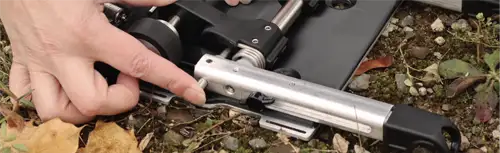 push the locking pin into the hole on the swing arm
