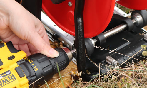 solinst power winder being used with standard drill to wind water level meter in the field