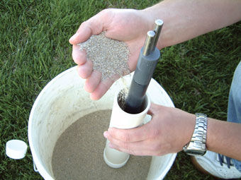 pouring sand into cmt multilevel system sand cartridge