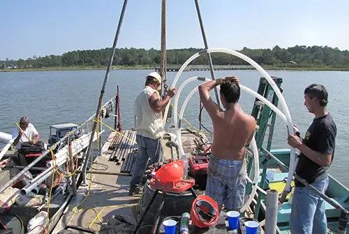 cmt systems were installed at the bottom of a bay to measure submarine groundwater discharge eight 7 channel cmt systems were installed with custom modifications to suit the open water application watertight wellheads had to be custom built to allow for sampling from the surface of the bay using a peristaltic pump